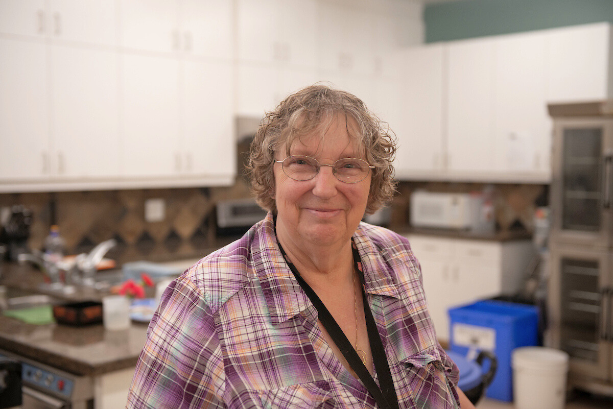 A staff member smiling